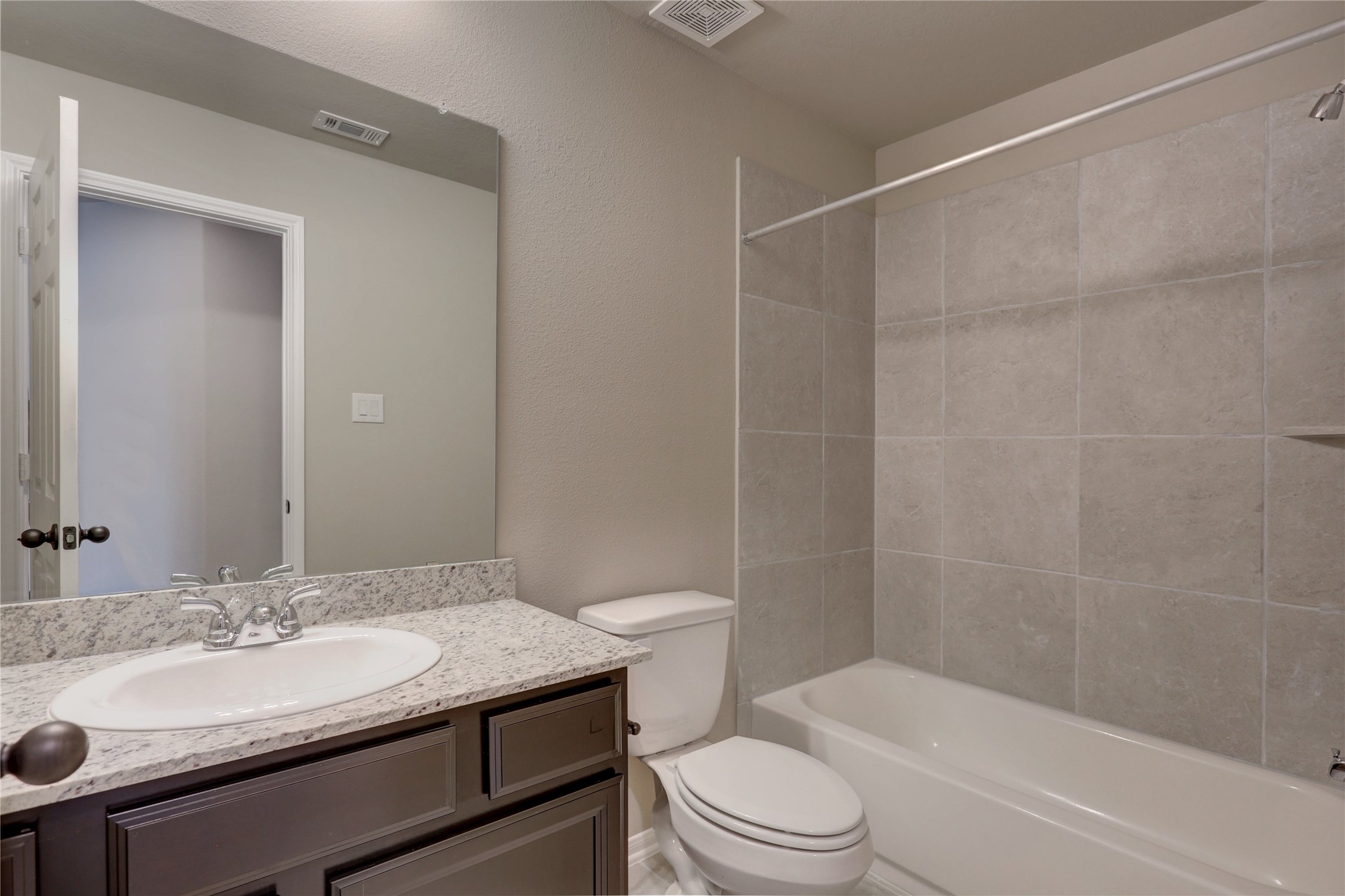 403 Black Walnut Drive Conroe, TX 77304 - Photo 8 of 15 a bathroom with a granite countertop sink toilet and shower