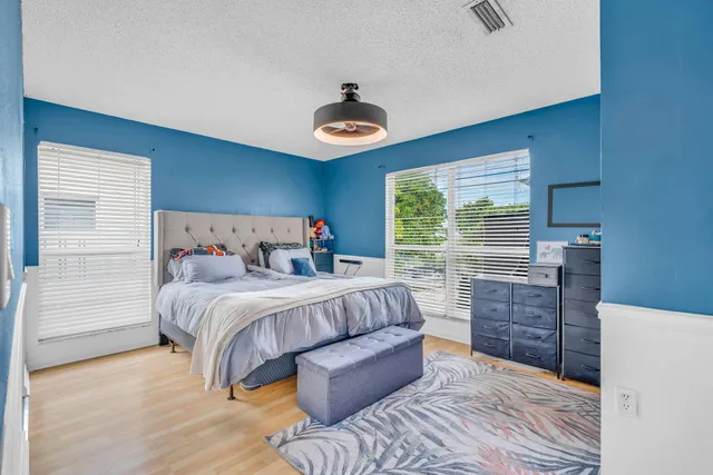 an aerial view of a house with a garden and plants