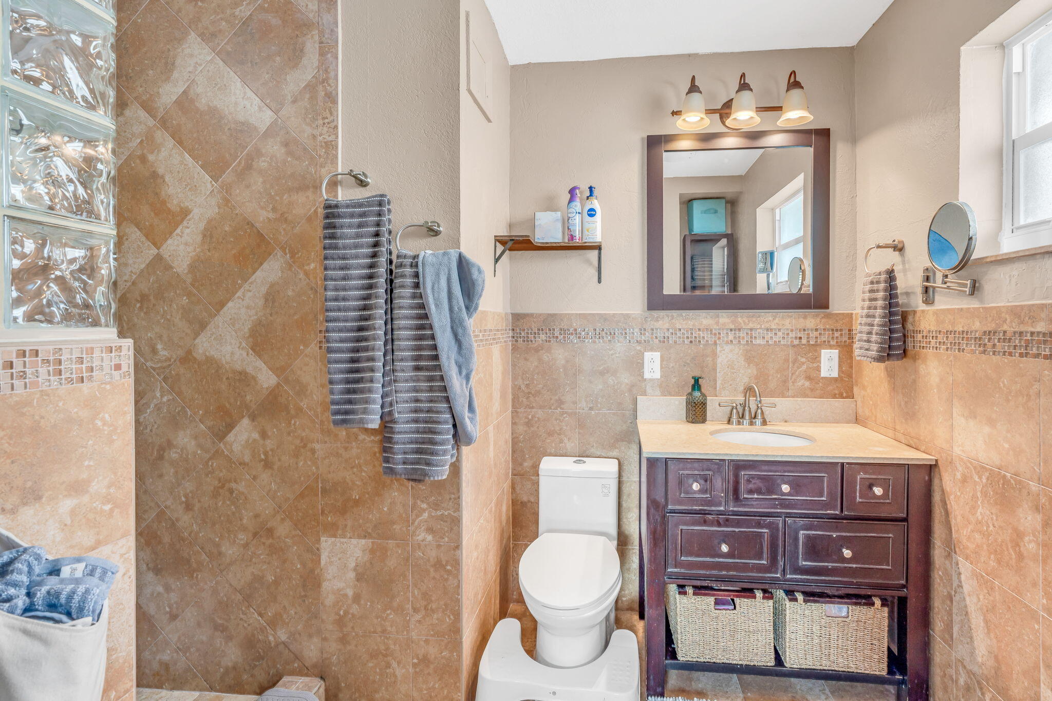 304 2nd Terrace Key Largo, FL 33037 - Photo 19 of 43 a bathroom with a granite countertop toilet sink and mirror