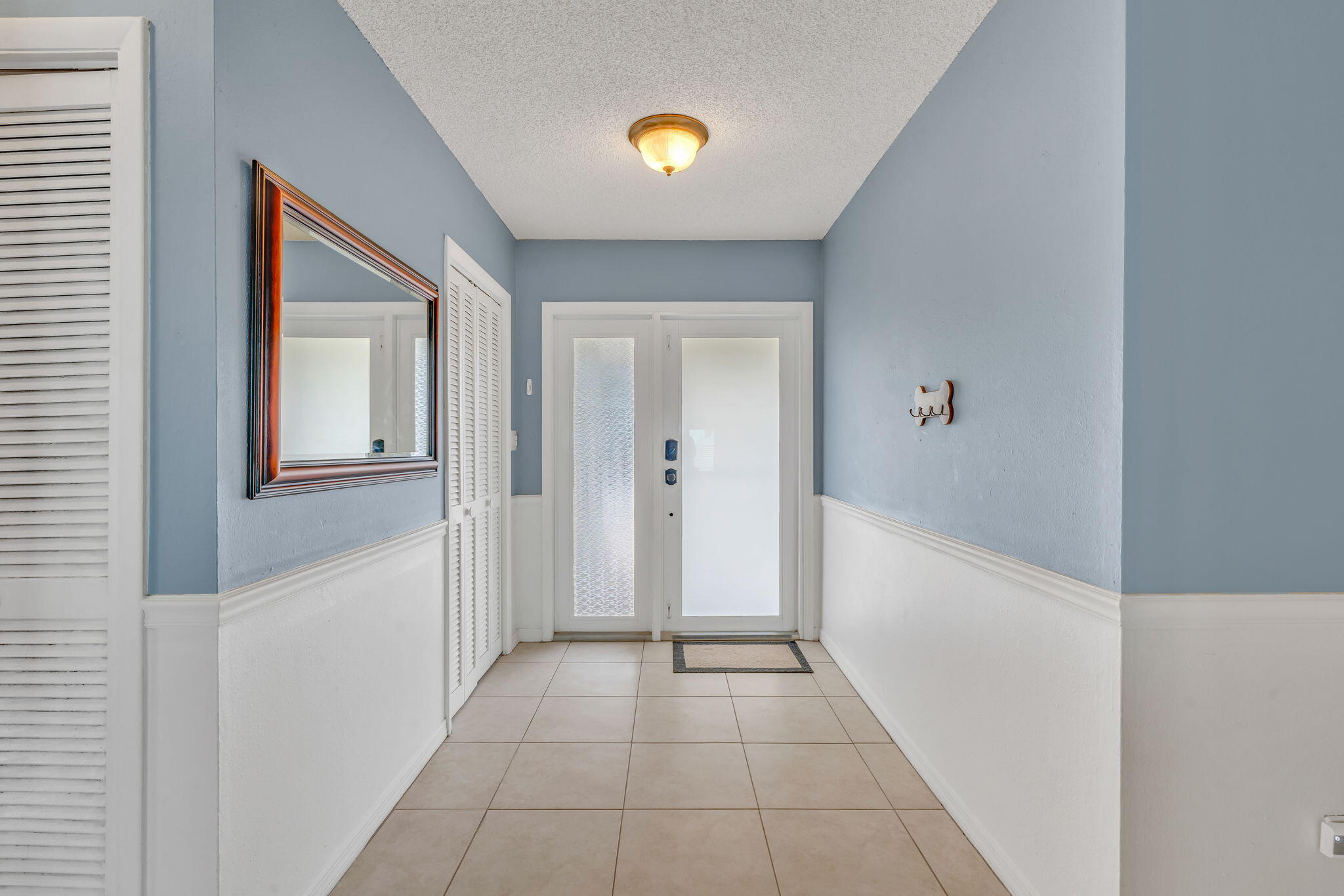 304 2nd Terrace Key Largo, FL 33037 - Photo 7 of 43 a view of an entryway with wooden floor