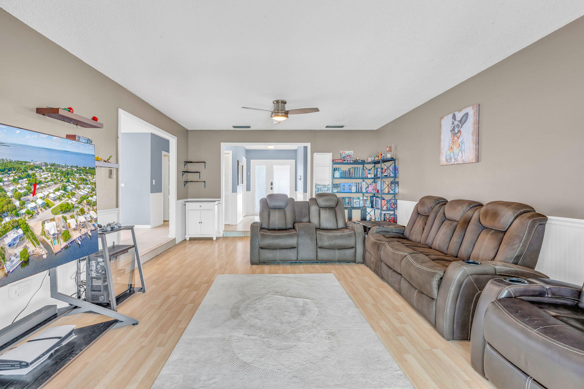 304 2nd Terrace Key Largo, FL 33037 - Photo 8 of 43 a living room with furniture and a flat screen tv