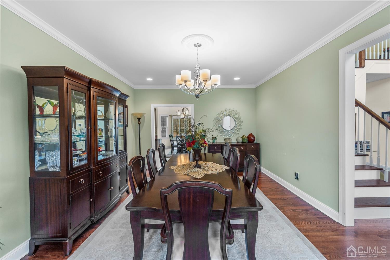 308 Plainfield Road Edison, NJ 08820 - Photo 16 of 40 a view of a dining room with furniture and a chandelier