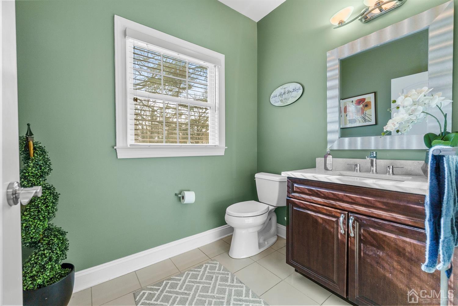 308 Plainfield Road Edison, NJ 08820 - Photo 18 of 40 a bathroom with a sink a toilet and mirror