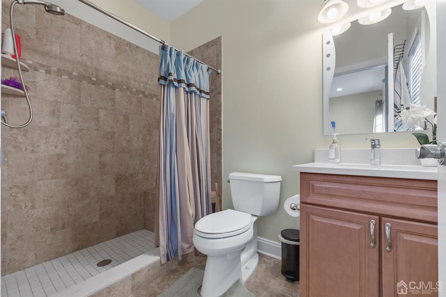308 Plainfield Road Edison, NJ 08820 - Photo 19 of 40 a bathroom with a sink a toilet and shower