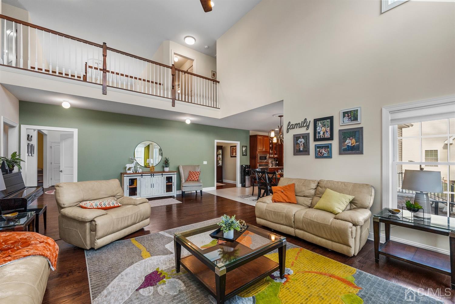 308 Plainfield Road Edison, NJ 08820 - Photo 22 of 40 a living room with furniture a rug and a chandelier