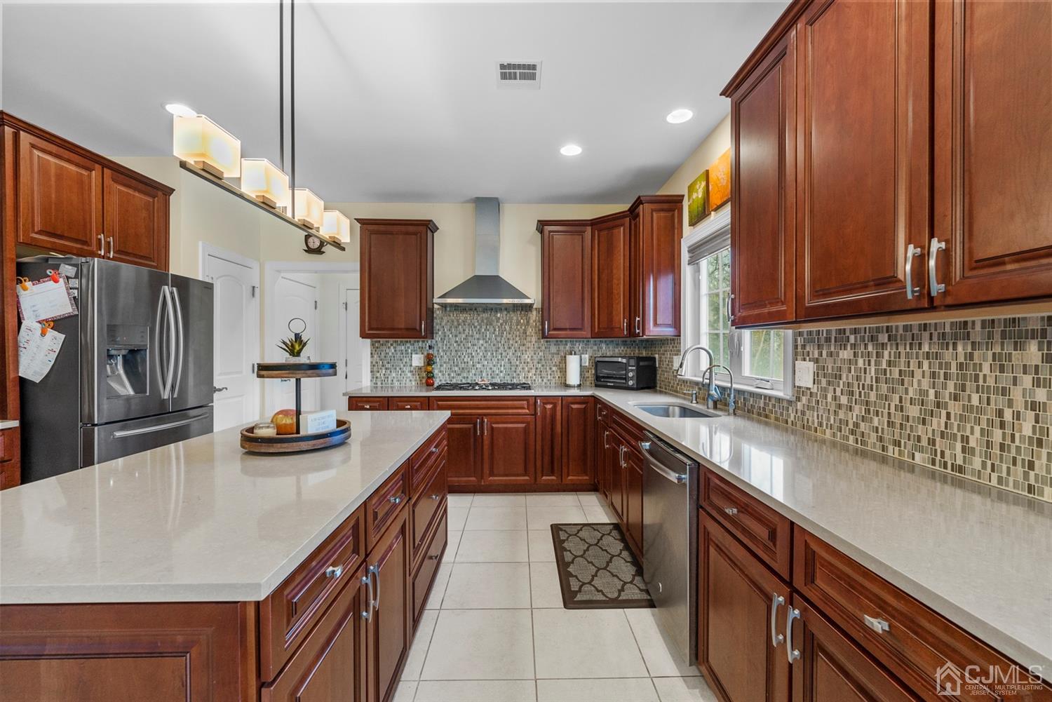 308 Plainfield Road Edison, NJ 08820 - Photo 24 of 40 a kitchen with stainless steel appliances granite countertop a sink stove and refrigerator