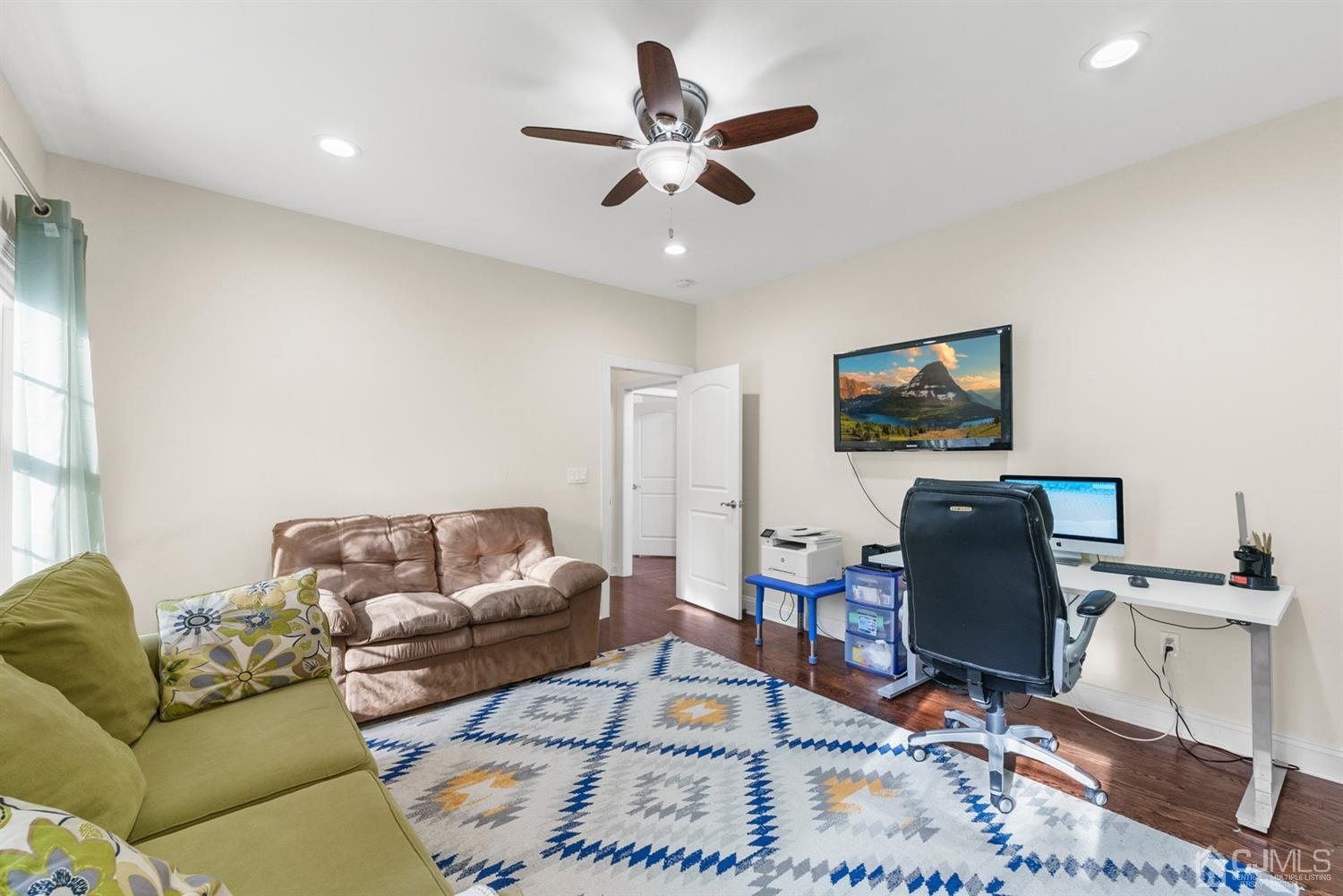 308 Plainfield Road Edison, NJ 08820 - Photo 27 of 40 a living room with furniture and a flat screen tv