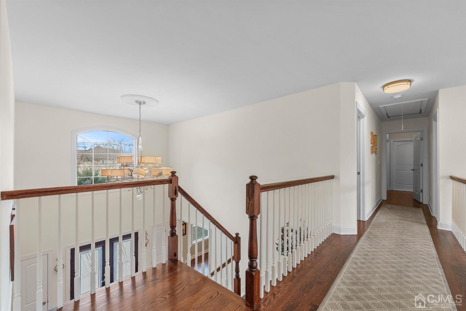 308 Plainfield Road Edison, NJ 08820 - Photo 28 of 40 a view of a hallway with wooden floor and stairs