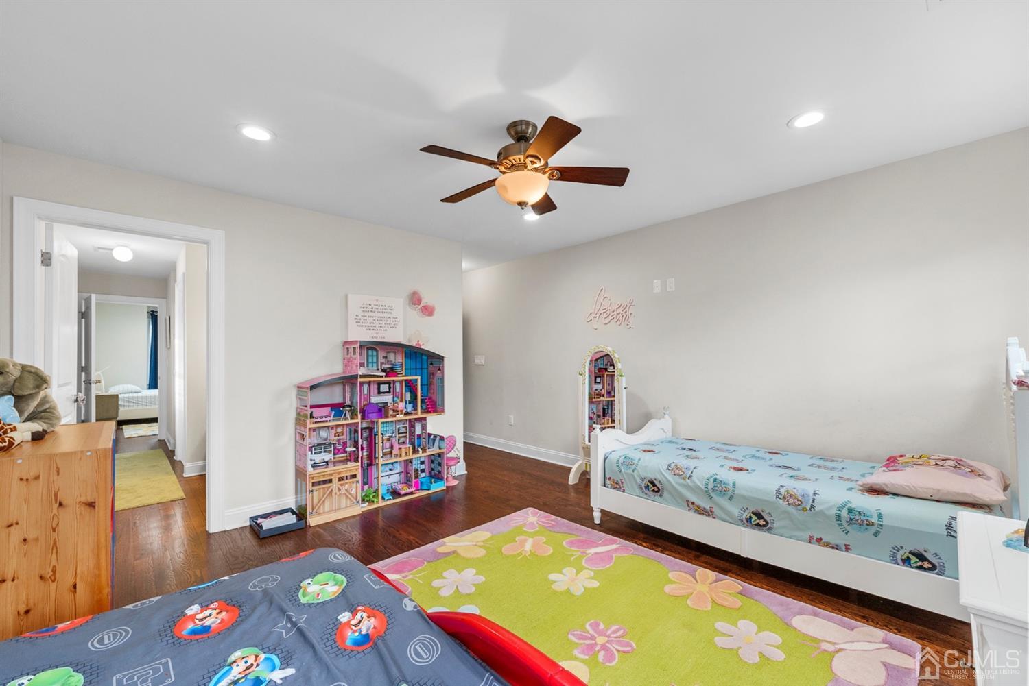 308 Plainfield Road Edison, NJ 08820 - Photo 33 of 40 a bedroom with a bed and a chandelier