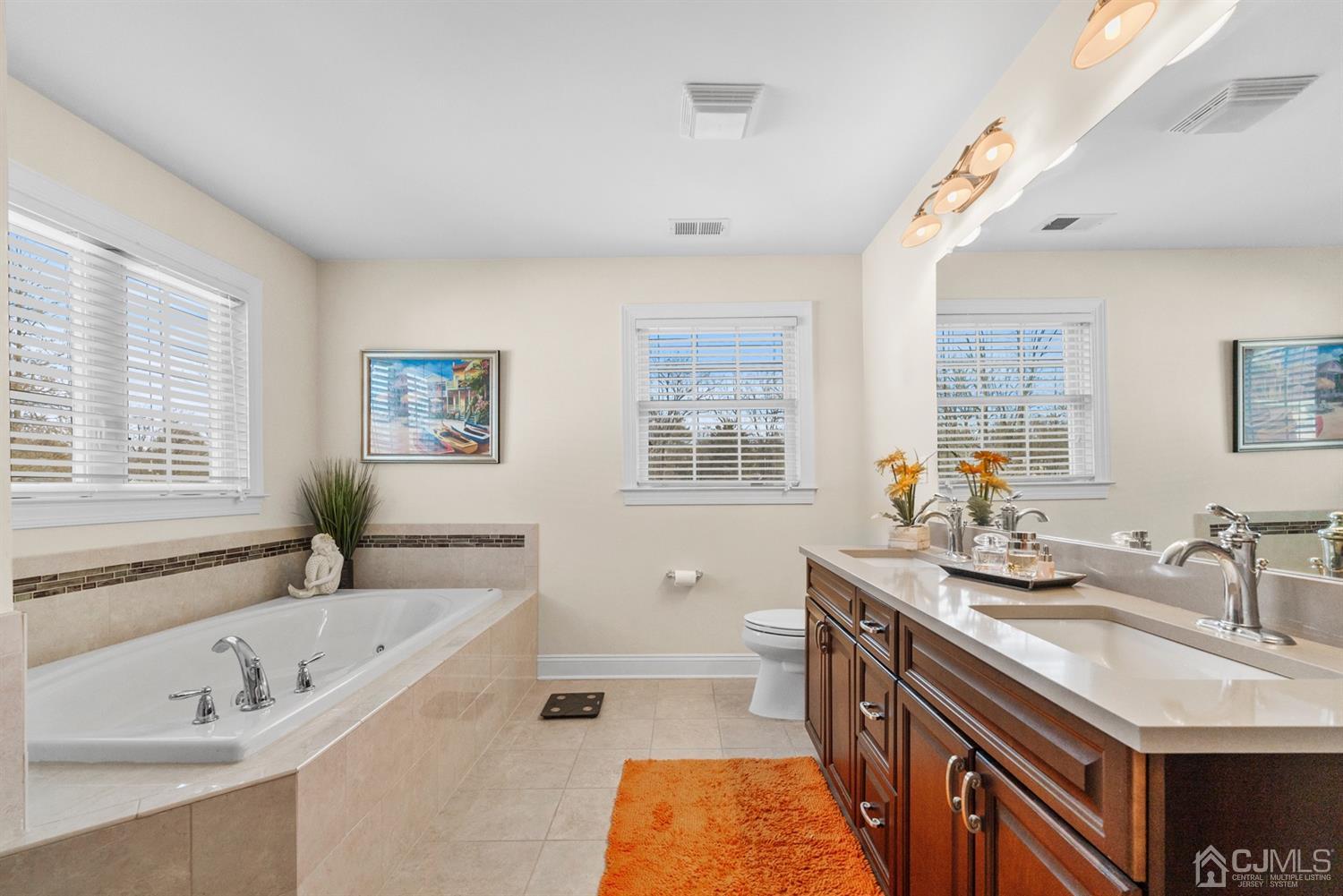 308 Plainfield Road Edison, NJ 08820 - Photo 38 of 40 a spacious bathroom with sinks a tub double vanity and windows