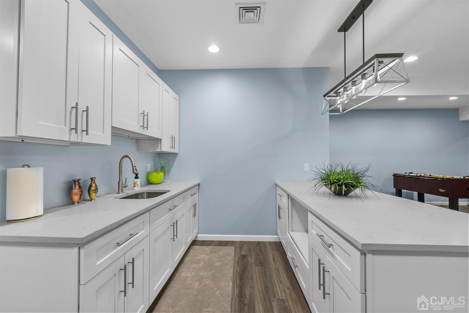 308 Plainfield Road Edison, NJ 08820 - Photo 10 of 40 a kitchen with a white cabinets and chandelier