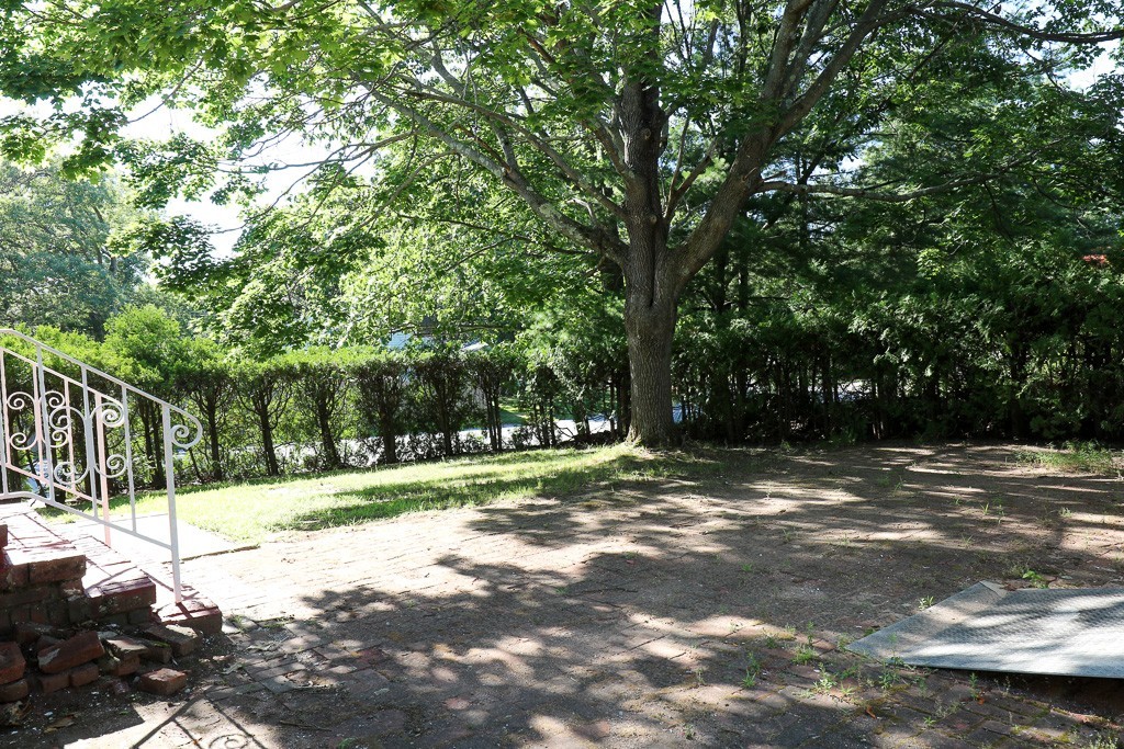 1 Standish Road Lawrence, MA 01843 - Photo 12 of 13 a view of a yard with large trees