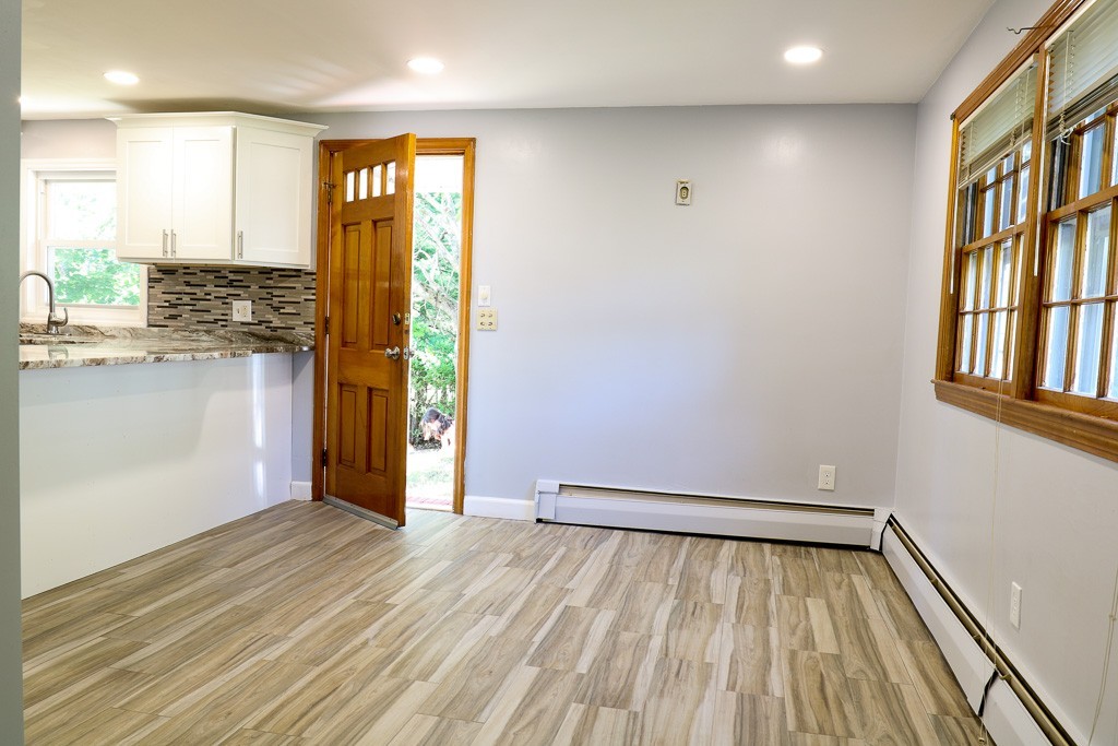 1 Standish Road Lawrence, MA 01843 - Photo 4 of 13 a view of empty room with wooden floor and fan