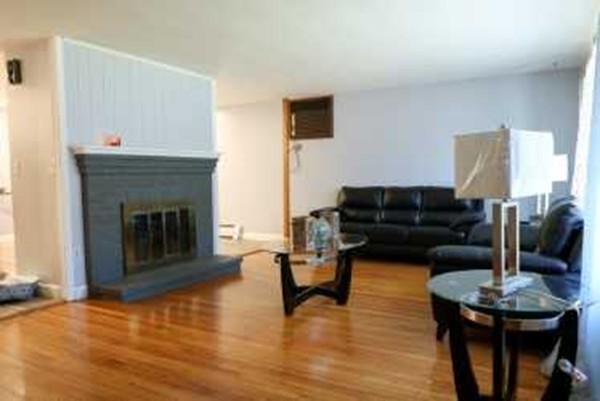 1 Standish Road Lawrence, MA 01843 - Photo 6 of 13 a living room with furniture and a fireplace