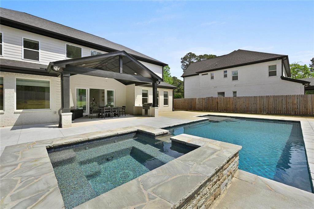 2694 Thompson Mill Road Buford, GA 30519 - Photo 70 of 70 a view of a house with pool and a yard