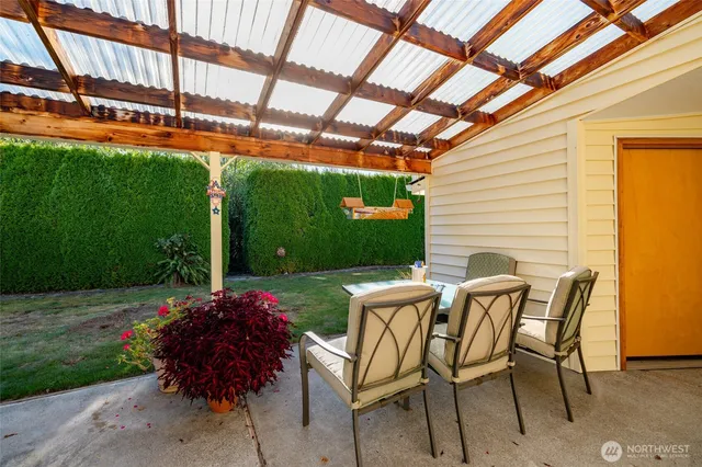 a view of yard with seating area and green space