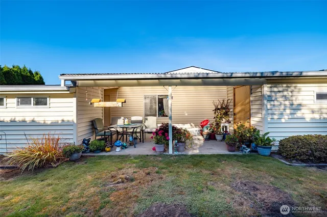 a view of a lake with a house in the background