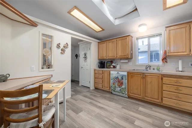 a kitchen with a refrigerator and cabinets