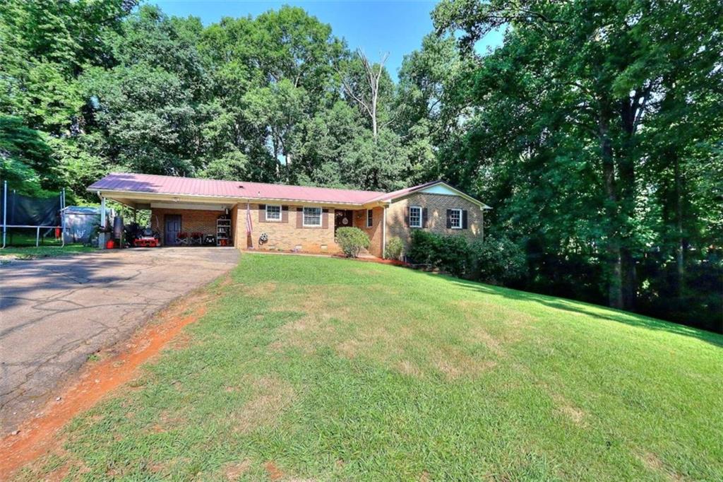 89 Old Airport Road Commerce, GA 30530 - Photo 1 of 1 a view of a house with pool and yard