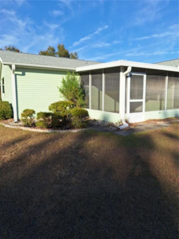 8202 Southwest 108th Pl Road Ocala, FL 34481 - Photo 21 of 22 SCREENED PATIO OFF BACK OF HOUSE