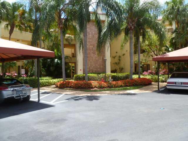 7508 La Paz Court, Unit 309 Boca Raton, FL 33433 - Photo 1 of 1 a view of a street with cars parked in front of it