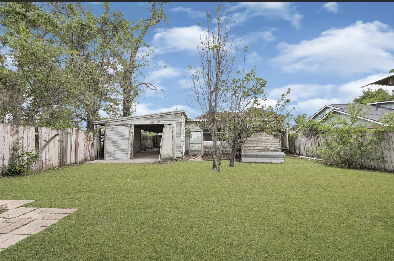 209 Frawley Street Houston, TX 77009 - Photo 11 of 21 a view of a house with a yard and garage