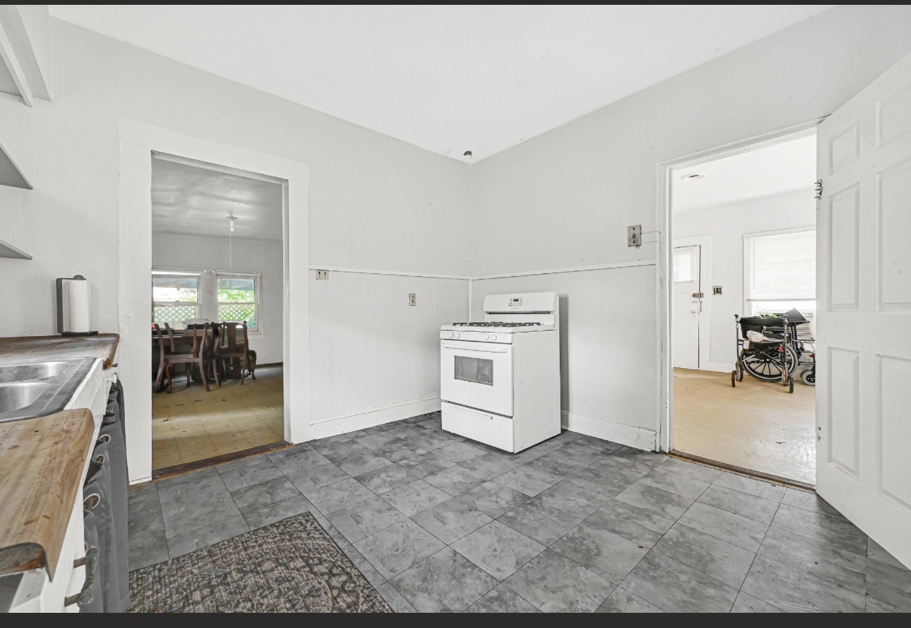 209 Frawley Street Houston, TX 77009 - Photo 13 of 21 a view of a livingroom with a furniture and kitchen view