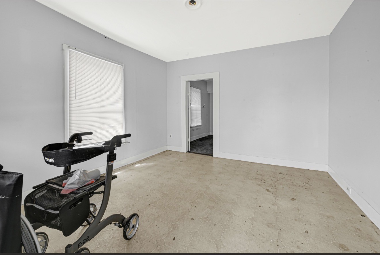 209 Frawley Street Houston, TX 77009 - Photo 16 of 21 a room with gym equipment and wooden floor