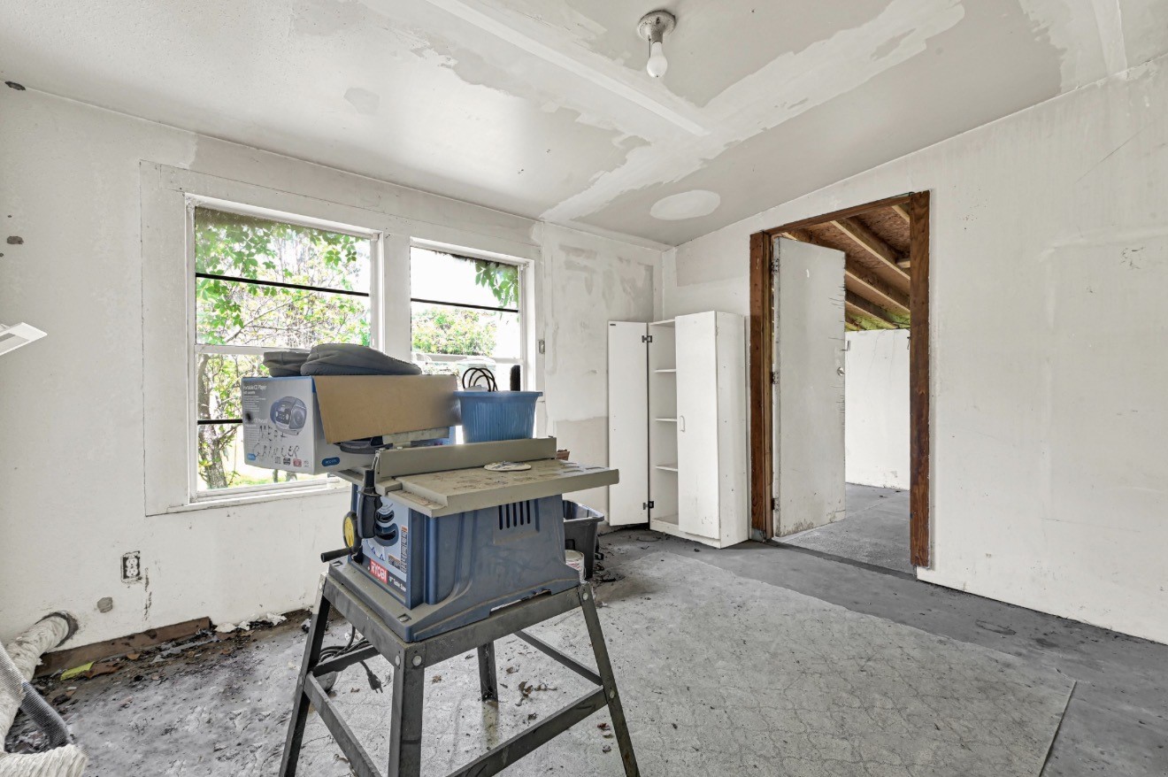 209 Frawley Street Houston, TX 77009 - Photo 19 of 21 a view of a workspace with furniture and a window