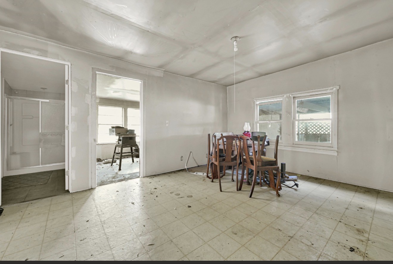 209 Frawley Street Houston, TX 77009 - Photo 20 of 21 a dining room with furniture and a chandelier