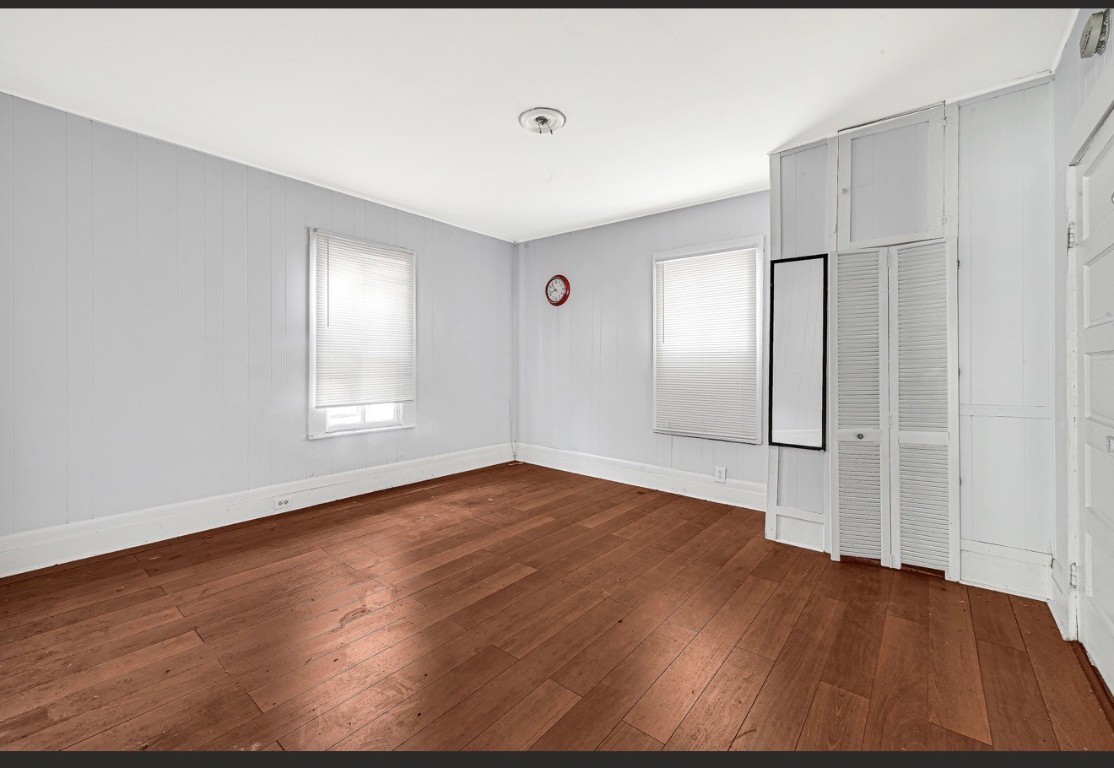 209 Frawley Street Houston, TX 77009 - Photo 21 of 21 a view of empty room with wooden floor and fan