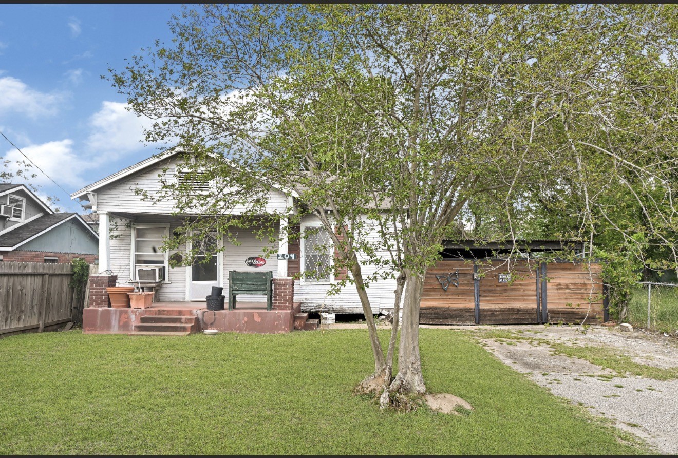 209 Frawley Street Houston, TX 77009 - Photo 3 of 21 a front view of a house with garden