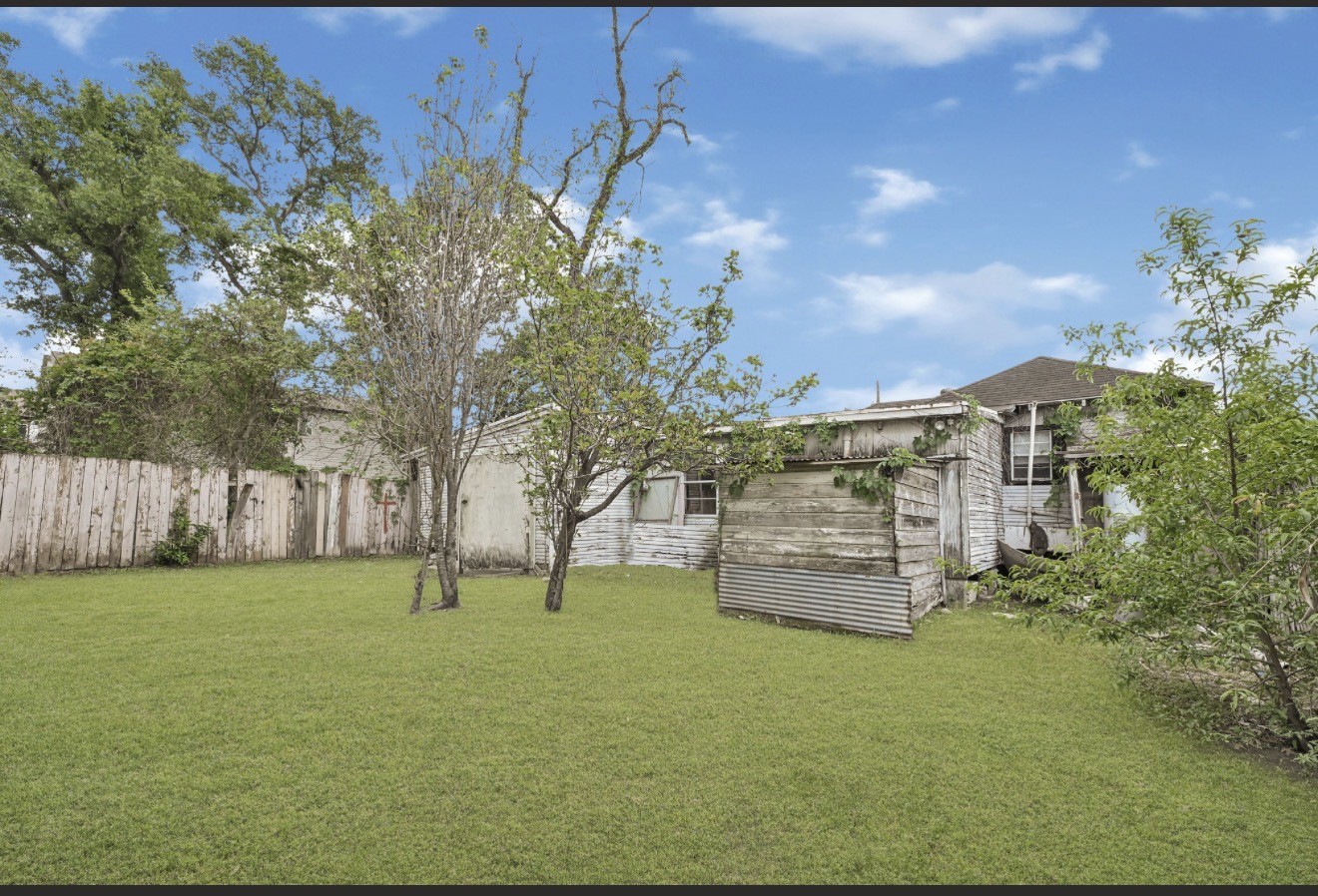 209 Frawley Street Houston, TX 77009 - Photo 10 of 21 a view of a backyard with large trees