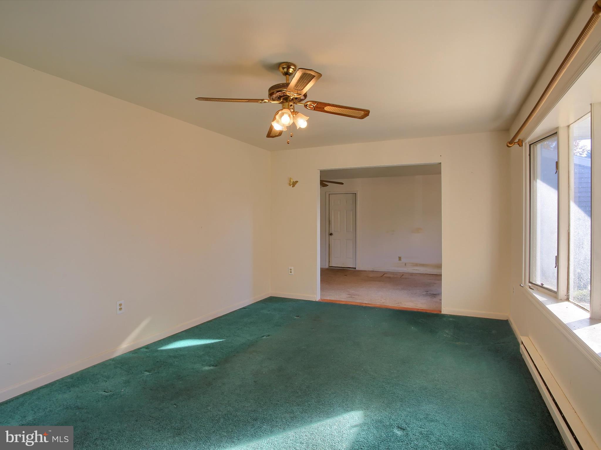 151 Oak Flat Road Newville, PA 17241 - Photo 20 of 33 a view of an empty room with window and chandelier fan