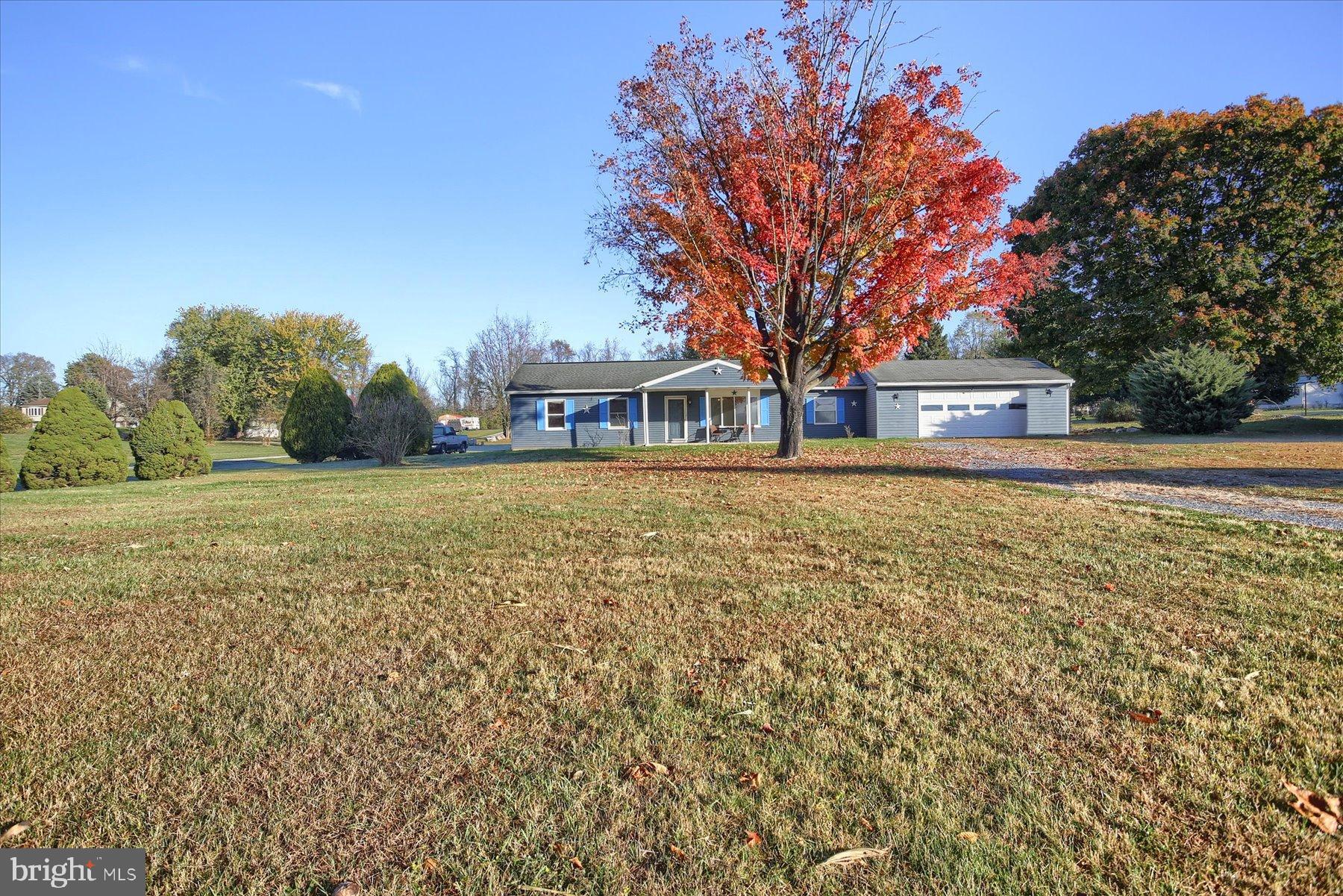 151 Oak Flat Road Newville, PA 17241 - Photo 2 of 33 a view of a house with a big yard and large trees