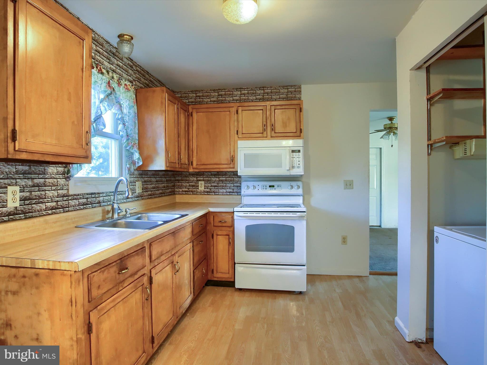 151 Oak Flat Road Newville, PA 17241 - Photo 10 of 33 a kitchen with a sink a stove and cabinets