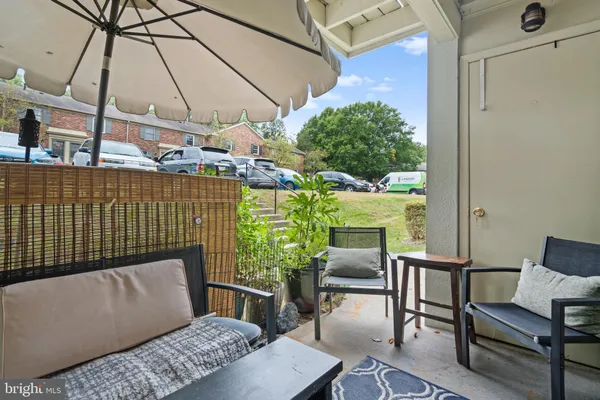 a outdoor living space with furniture and a potted plant