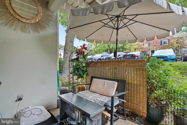 a balcony view with a seating space