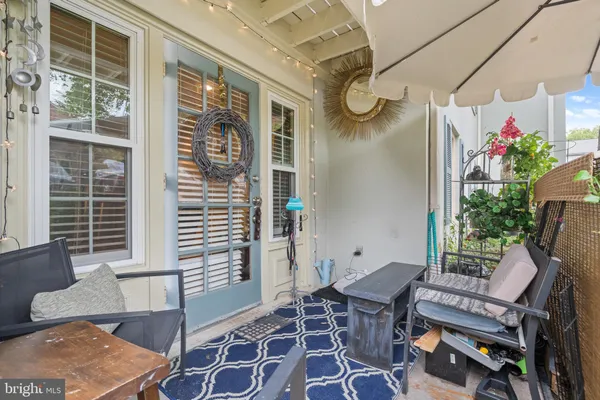 a front view of a house with outdoor seating