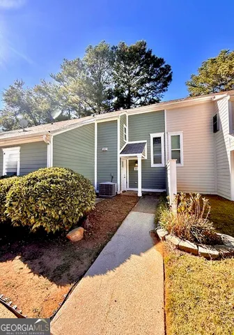 a view of a backyard of the house