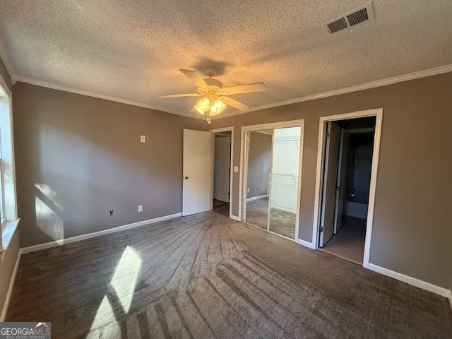 a view of a livingroom with a chandelier fan