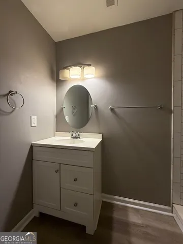 a room with a sink and a mirror