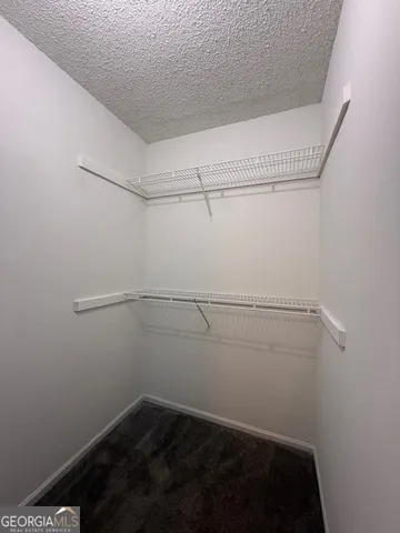 a view of a room with racks on the wall