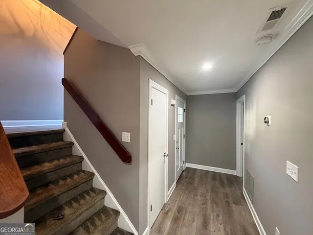 a view of entryway with wooden floor