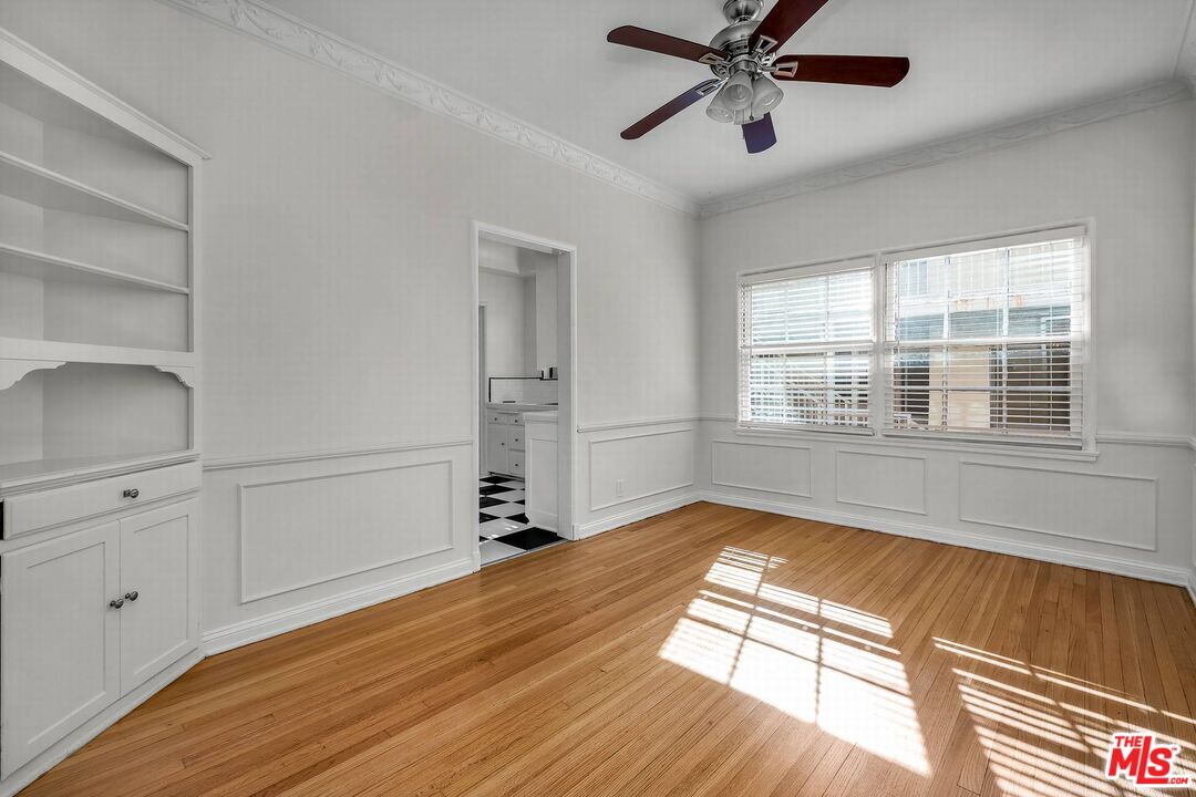 614 Midvale Avenue Los Angeles, CA 90024 - Photo 18 of 18 a view of empty room with wooden floor and fan