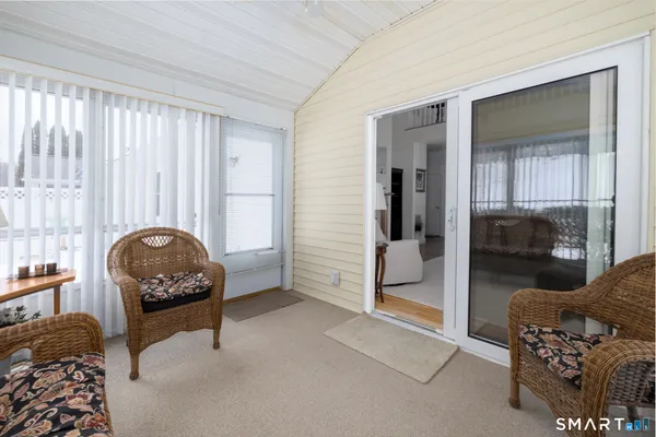 a bedroom with furniture and a gate