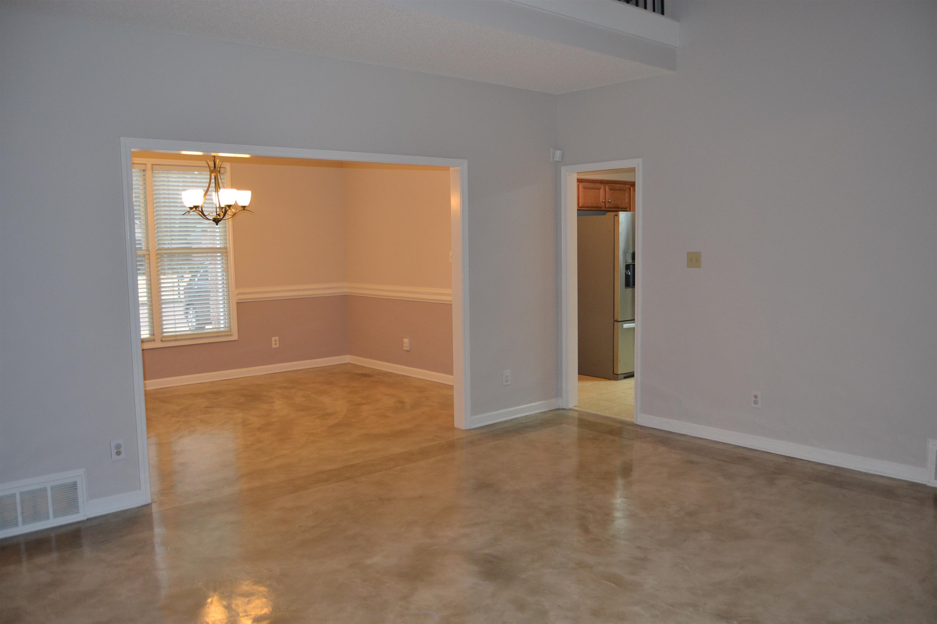 10486 Juneau Way Collierville, TN 38017 - Photo 8 of 33 Empty room featuring an inviting chandelier