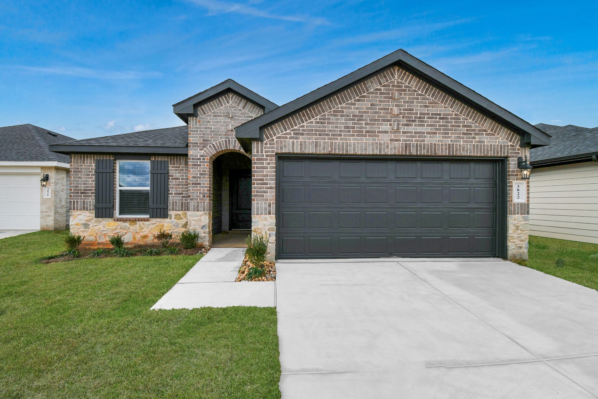 3822 Zoeys Way Fulshear, TX 77423 - Photo 1 of 37 a front view of a house with a yard
