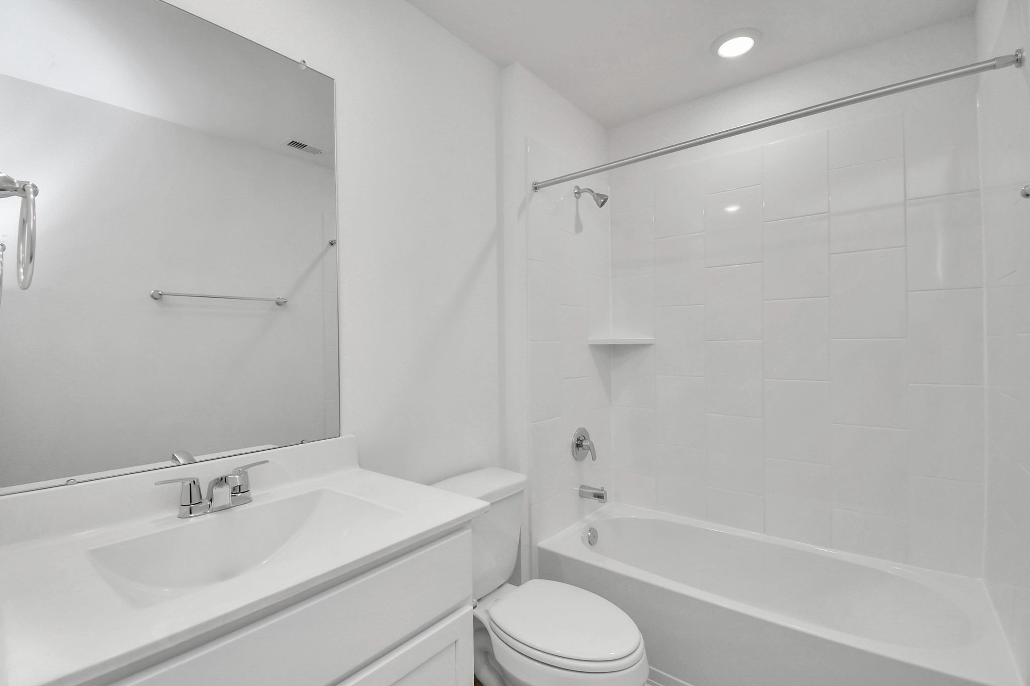 3822 Zoeys Way Fulshear, TX 77423 - Photo 22 of 37 a bathroom with a bathtub shower sink vanity mirror and toilet