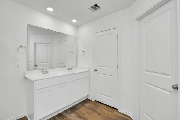 a bathroom with a sink and mirror